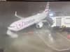 Moment plane weighing 90K lbs is blown away from airport gate by ferocious 80mph winds in shocking footage
