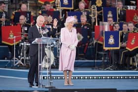 King Charles III and Queen Camilla on stage
